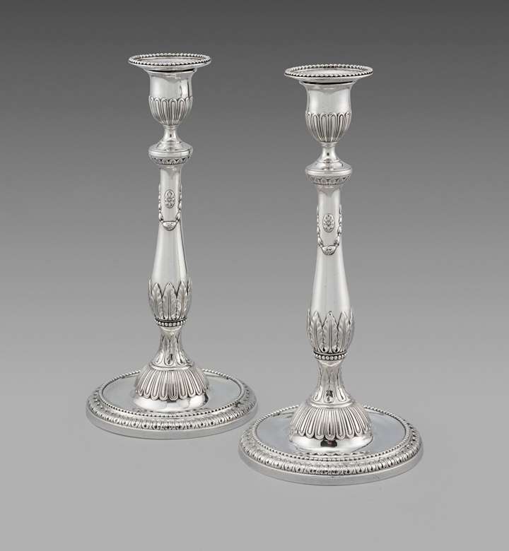 A Pair of George III Candlesticks
